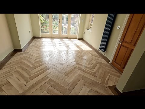 Herringbone pattern tiles installation.