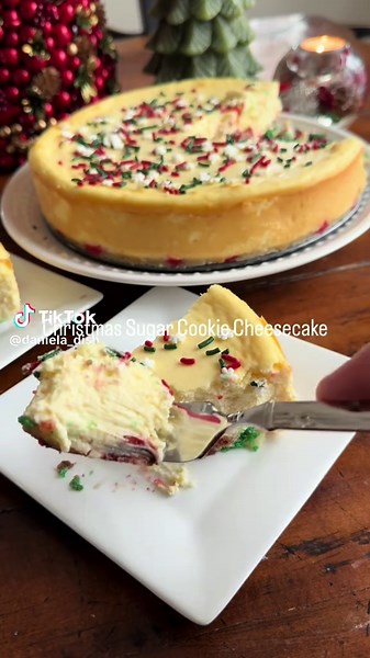 Christmas Cookie Cheesecake. This is a combination of our two Christmas favorites, Sugar cookies and cheesecake. The base of this cheesecake is a Christmas cookie crust thats baked first to form the perfect base for the cheesecake. Make it extra fun and colorful by using the pre decorated sugar cookies. This cheesecake filling is so creamy and delicious it’s the perfect dessert for Christmas Day. 🎄🎄 Save This Recipe! Can be adapted for any holiday! 4 8 oz packages of cream cheese, room temp 1 