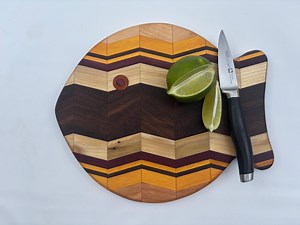 A chevron pattern fish bar/cutting/charcuterie board made of (mostly) locally sourced hardwood.