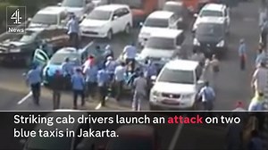 97K views · 416 reactions | 10,000 Indonesian taxi drivers have blocked off major roads and attacked other vehicles in protest against Uber. They’re angry that the app is one of those given government backing – and they fear it could put them out of a job. | Channel 4 News | Facebook