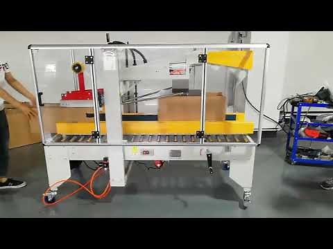 Automatic carton box taping machine