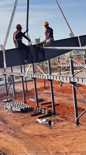 Steel Structure Installation: Workers Installing Steel Beams in the Air!