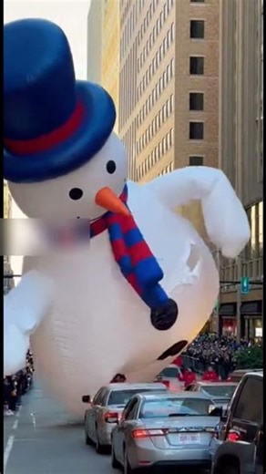 Runaway Parade Balloon Deflates Over Traffic Light, Turning Downtown Intersection Into Cartoon Chaos