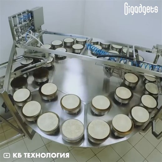 This automated line can make 1,200 stuffed pancake rolls per hour. KB Technology is engaged in the production of devices for making dumplings, pancakes and chebureks. The model in the video is BLK-1200 OPTI pancake production machine that weighs 1,984 lbs (900 kg). It evenly places the dough on the pan and fries both sides of it. The fried pancake goes to a conveyor for further filling and folding. | GIGadgets
