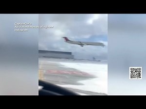 Watch Delta flight flip over while landing
