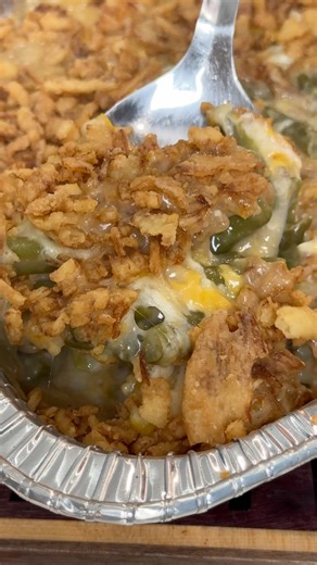 The holiday classic green bean casserole gets a smoky makeover with this quick and easy smoked green bean casserole recipe. A flavorful blend of green beans, cream of mushroom soup, and cheddar cheese, this hearty side dish is the perfect accompaniment to your Thanksgiving dinner or any other gathering. The best part? It takes less than 10 minutes to prep and 40 minutes to cook in the oven or smoker, making it an ideal last-minute dish! | Ninjacue