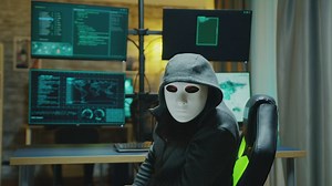 Portrait of a hacker wearing a mask - Free Stock Video