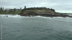 4k Drone of ocean sea waves and rocky cliff at Yamba, Australia.