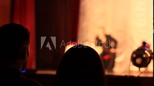 spectators watching performance in the theater