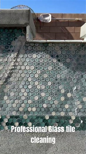 Effectively cleaning glass pool tile using a mineral blaster! No scratches or etching of the glass