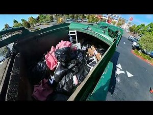 Garbage truck compacting garbage compilation
