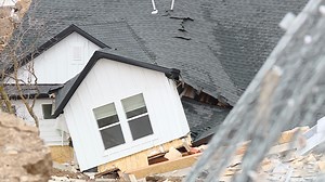 Videos capture moment houses slide off a cliff
