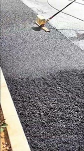 Road repair techniques are carried out neatly using compaction equipment.