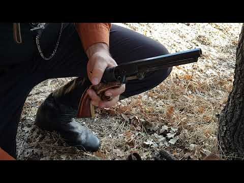 Loading Colt Navy 1851, .36 Cal. with authentic paper cartridges.