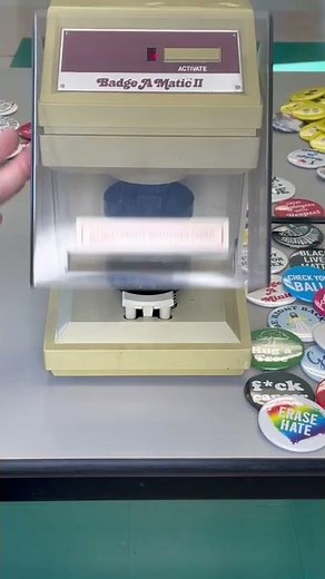 Making a button with the Badge-A-Minit automatic button making machine.