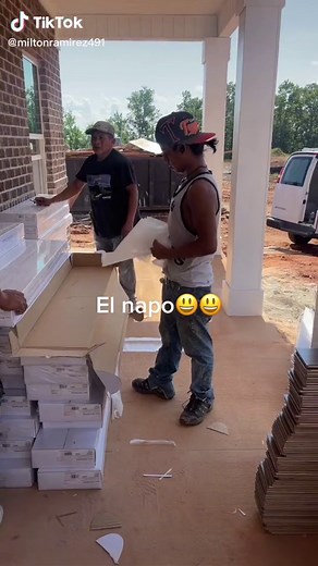 Handling and Stacking Cardboard Boxes Outdoors