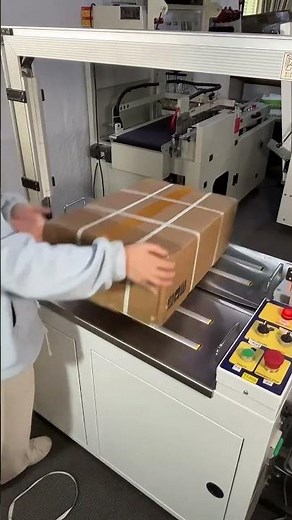 Automatic strapping machine, one strap per second, fully automatic packaging machine operation.