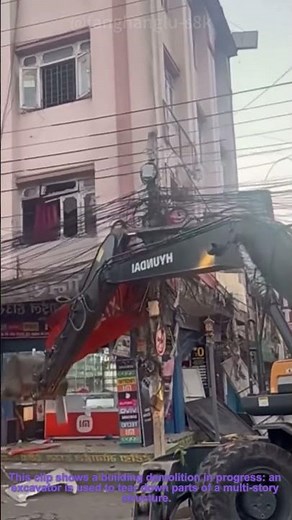 Building Demolition: Using Excavator to Remove Structure Parts