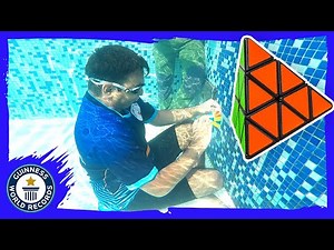 Most Pyraminx (Rubik's Cubes) solved underwater - Guinness World Records