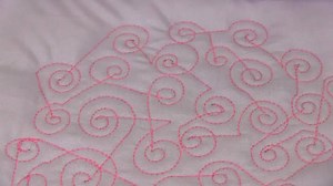 A new APQS video tutorial is up, and we’re breaking all the rules in this background filler design called “Swirls on a string!” APQS Dealer and educator Angela Huffman demonstrates this fast, fun filler that is very forgiving, and perfect for longarm machines. | APQS