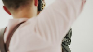 Model poses for photoshoot in white room slow motion - Free Stock Video