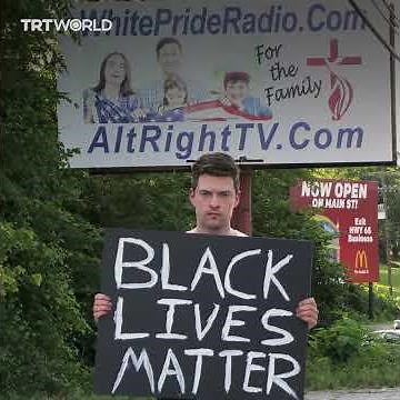 White man holds Black Lives Matter sign in America's most racist town