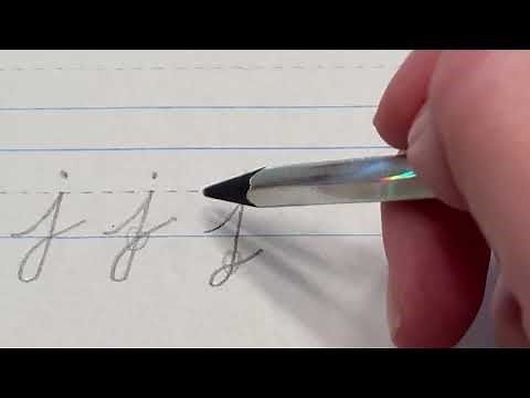 Lowercase "j" in cursive